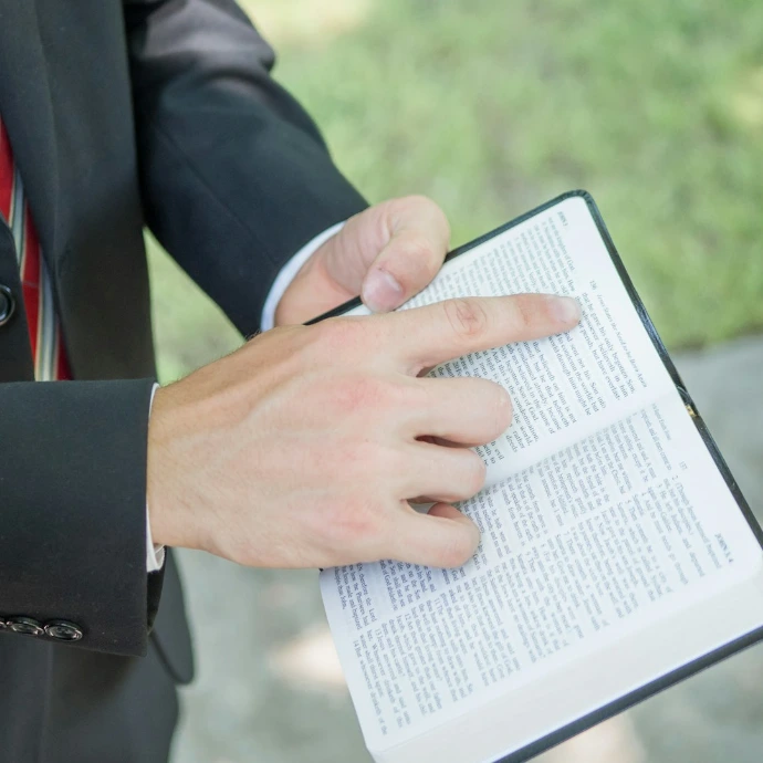 a close up of a person writing on a book
